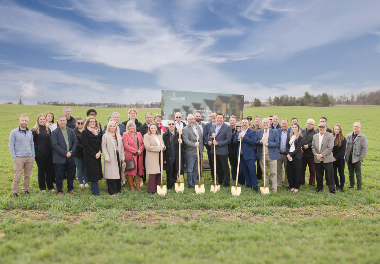group photo in front of construction signage